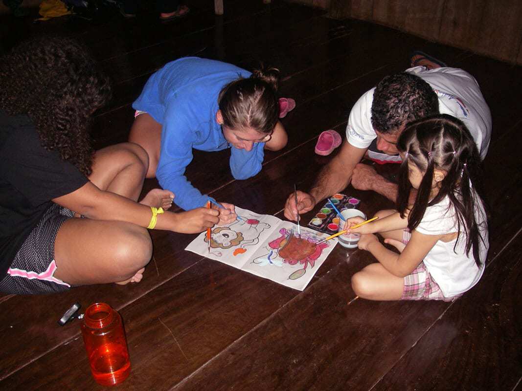 Students painting with local children - Pure Life Adventure in Costa Rica